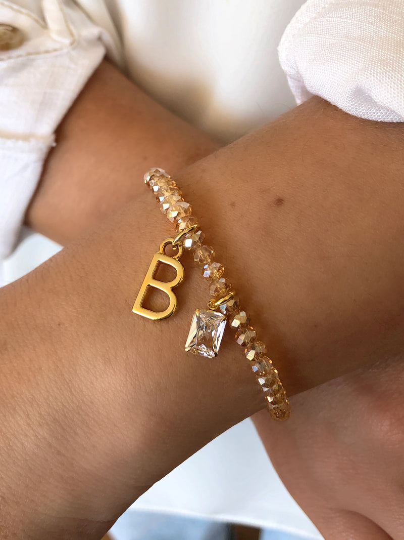 Pulseira De Cristais Lapidados Cor Dourado Personalizado Letra Média Com Baguete Zircônia