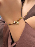Pulseira Mix Tons Marrons Pérola Natural e Sol 16cm