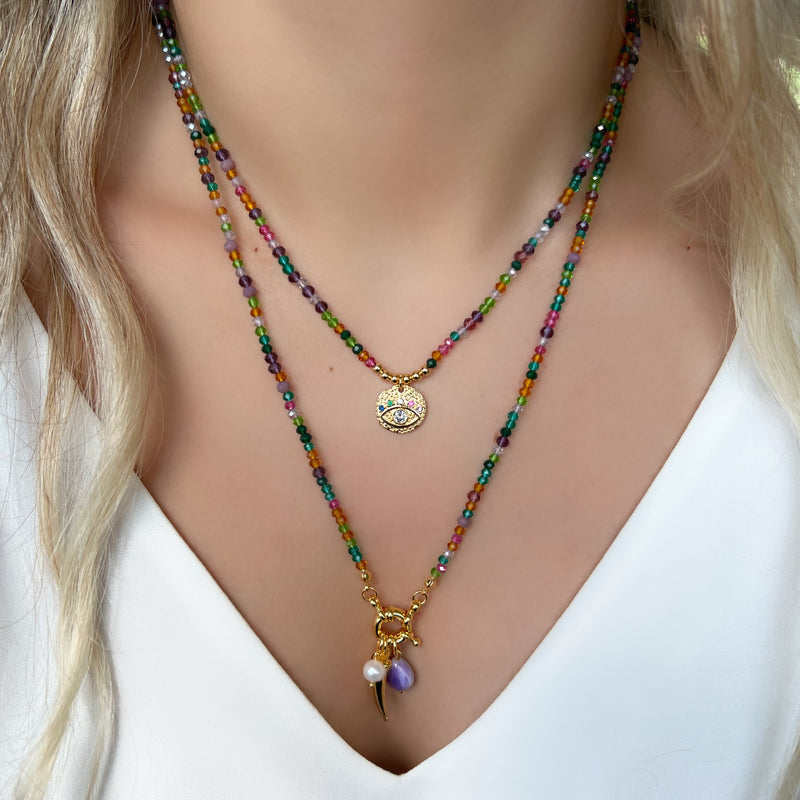 Mix de colares tons roxo e medalha olho grego